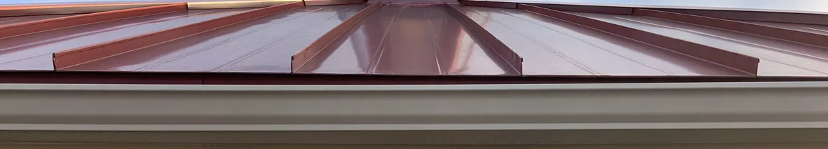 Close-up of mechanically seamed standing seam metal roof ribs